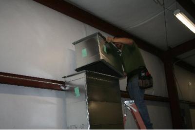 Air conditioning ducts being installed inside transmitter building